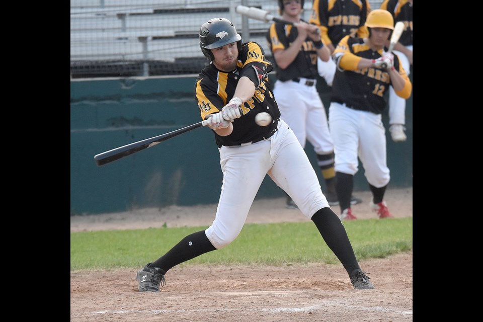 Miller Express hitter Michael Borst looks to put a Cardinals offering into play.