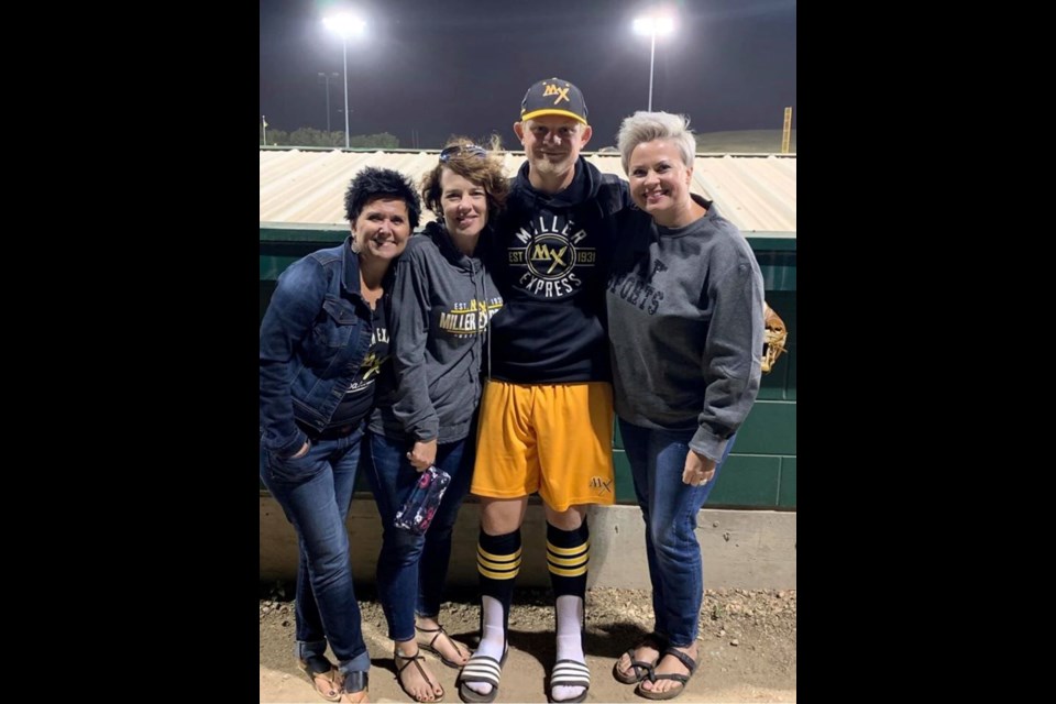 Reece Helland with family members after a Miller Express game last season. (Facebook photo).