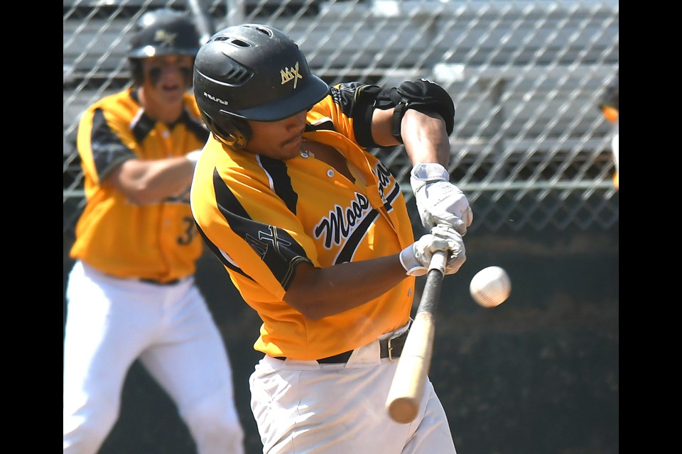 Dougie DelaCruz hits a single up the middle to bring home Chaz Poppy with Moose Jaw’s second run.