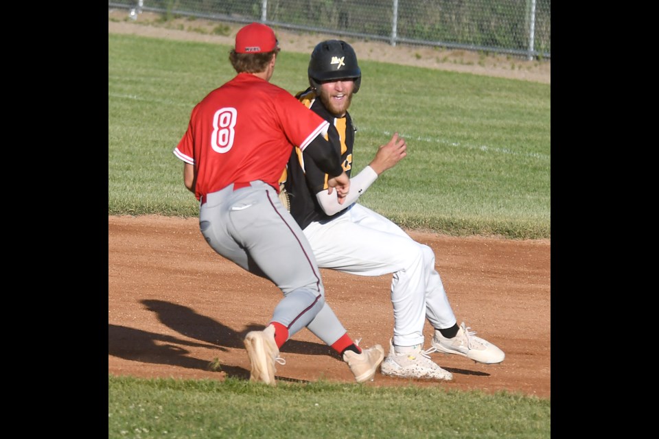 Miller Express baserunner Nate Mensik avoided the tag on the first part of this second-inning rundown…