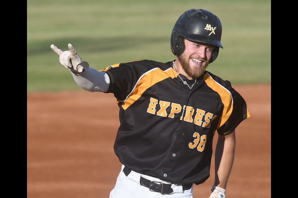 Nate Mensik acknowledges the crowd after hitting a lead-off home run in his first at bat after missing a month due to injury.