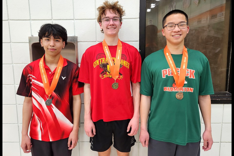 Central’s Cole Wilson (centre) won his first high school boys senior singles badminton title, with Zen Quimo (left) landing second and Peacock’s Allan Lu third.