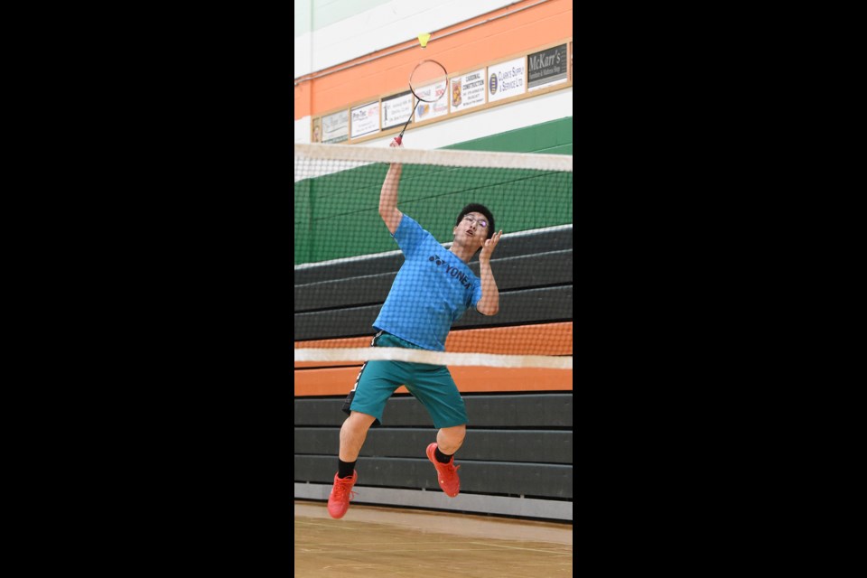 Vanier’s Hayden Mah goes up for a smash during action from high school senior badminton league action Thursday.