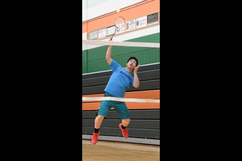 Vanier’s Hayden Mah goes up for a smash during action from high school senior badminton league action Thursday.