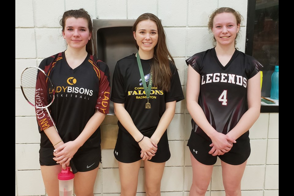 Winners of the Region A high school girls badminton championship are Danielle Reimer (LCBI, bronze), Kenzie Behrns (Cornerstone, gold) and Oliva Hudec (Fox Valley, silver).