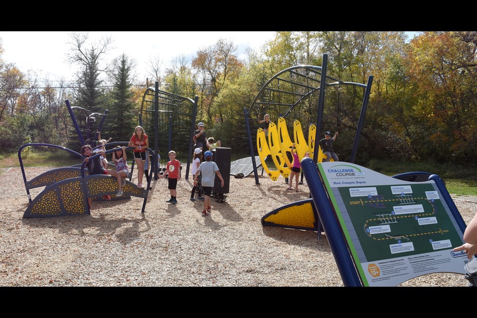 Children play on the Connor Park Challenge Course in this photo from Sept. 22, 2019 during the playground's official opening (photo by Randy Palmer)