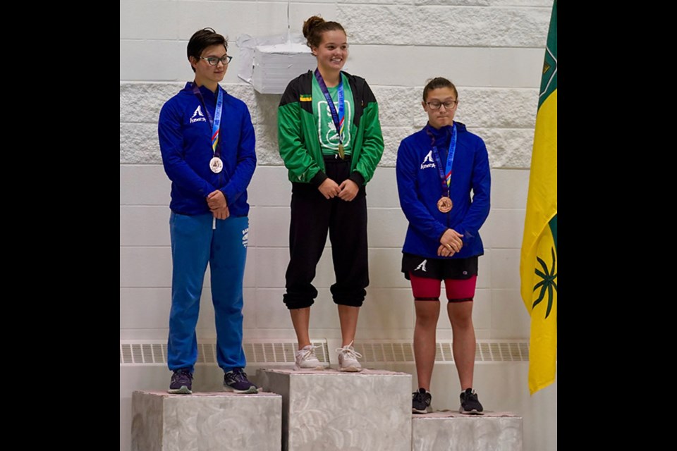 Cadence Johns on the podium after her gold medal win Saturday.
2019wcsg.ca photo