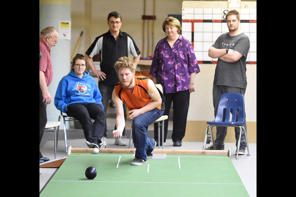 Moose Jaw’s David Morin delivers a shot during action from the indoor mat bowling tournament at Timothy Eaton Gardens Saturday