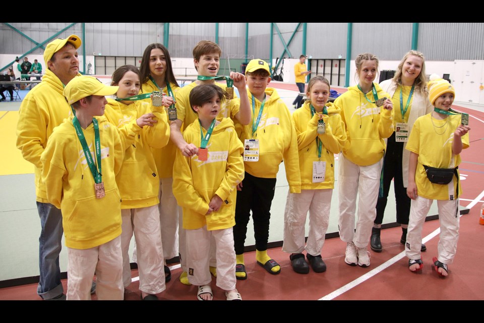 Members of the South West judo team pose for a photo with the impressive medal haul.