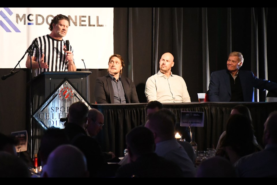 Kinsmen Sports Celebrity Banquet chairman Cory Olafson offering greetings as Teemu Selanne, Ryan Getzlaf and Pat Tabler look on.