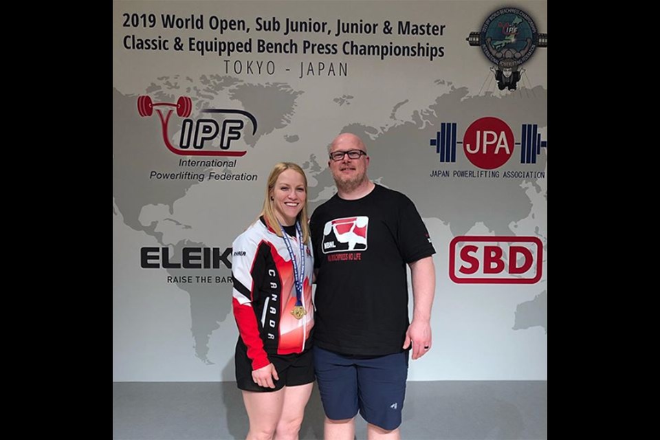 Moose Jaw’s Rhaea Stinn pauses for a photo with husband and coach Ryan Stinn after being presented with her world bench press championship gold medal. Instagram photo