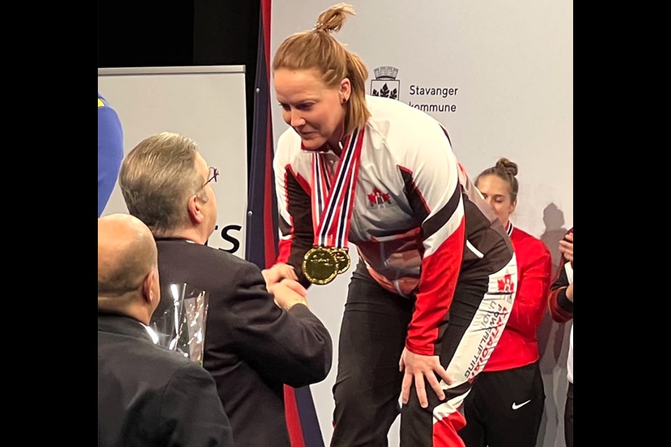 Moose Jaw’s Rhaea Stinn accepts her IPF World Championship gold medal.