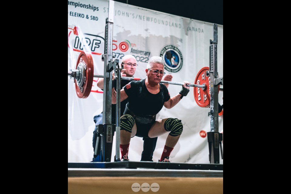Mava Brydges squatting at the IPF World Championships in St. John's, Newfoundland, where she took gold