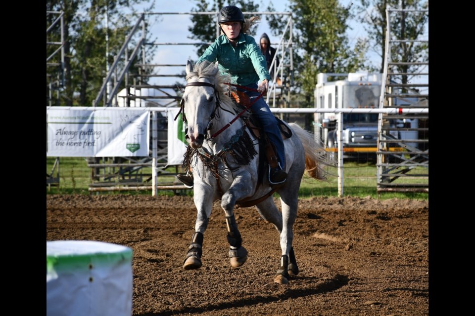 Charlene Rask gallops between barrel one and barrel two on Monday afternoon.