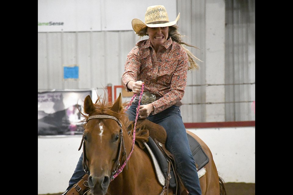 Charlsea Fiske shows the effort of riding Jailhouse Rockinic to a 14.410 second run -- good enough for eighth place heading into the second go.