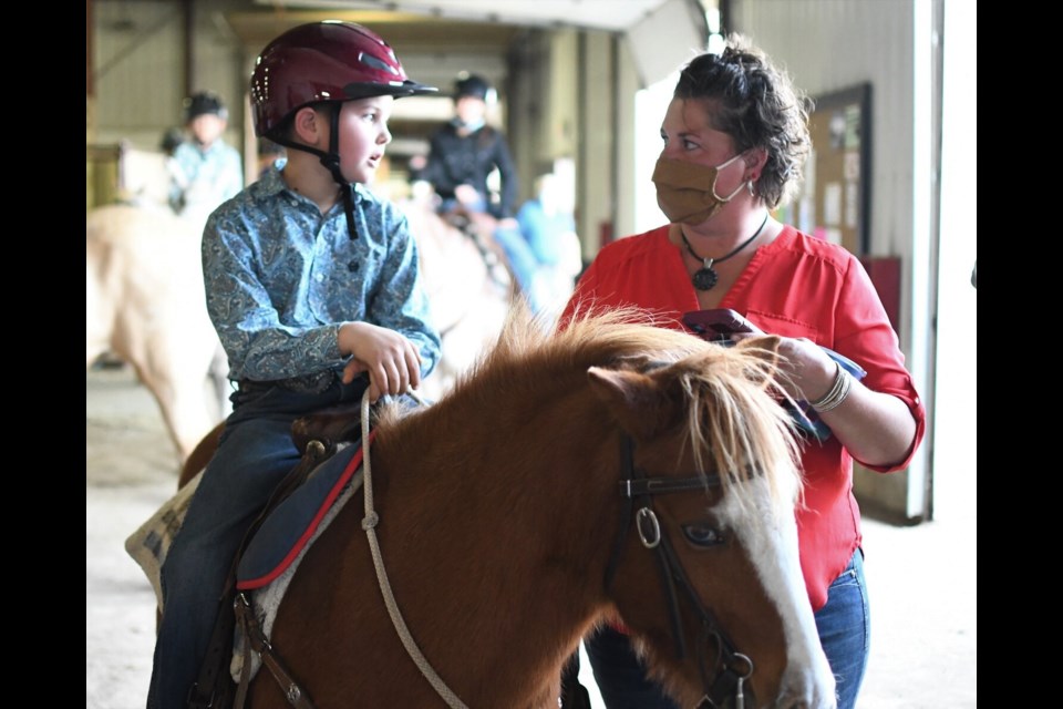 LAST MINUTE ADVICE - A competitor speaks to his mom at the moment he is set to go out and compete.