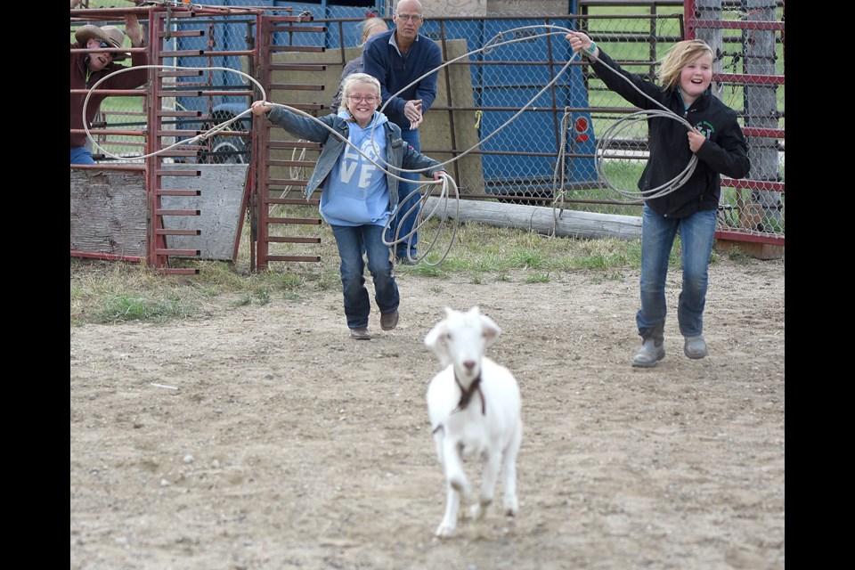 Youngsters take a crack at goat roping during the Twin Lakes Ranch Fun Youth Rodeo on Saturday.