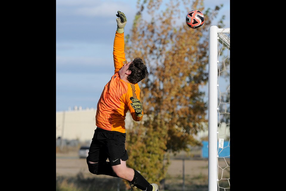 Swift Current goaltender Ethan Arnold couldn’t quite get to this free kick, which would rattle off the crossbar and lead to…