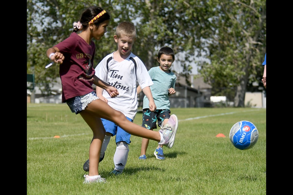 Youngsters in the Under-9 division play a mini-game during the Moose Jaw Soccer open house on Saturday afternoon.