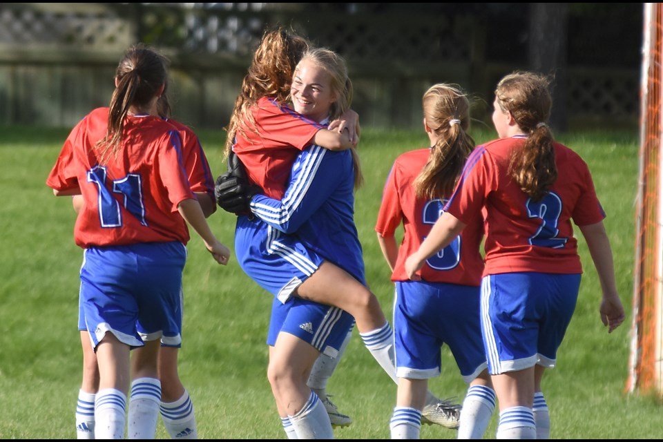 The Swift Current Ardens celebrate their Soccerfest tournament victory.