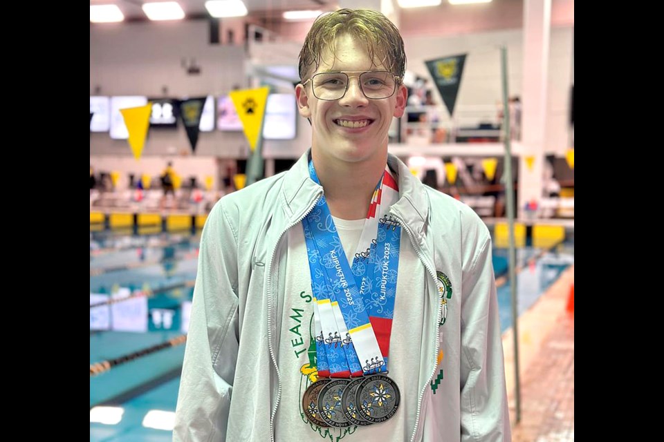 Kinsmen Flying Fins competitor Damian Chartrand with some of his medal haul from the North American Indigenous Games.