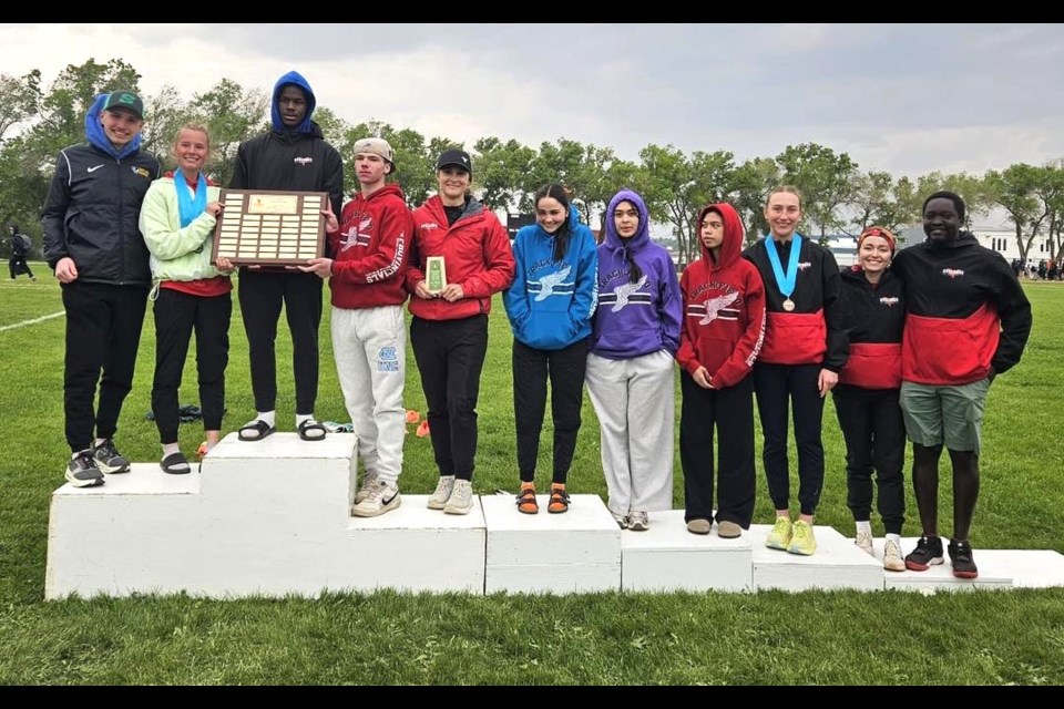 The Central Cyclones take the podium with the SHSAA track and field 4A team championship plaque. 