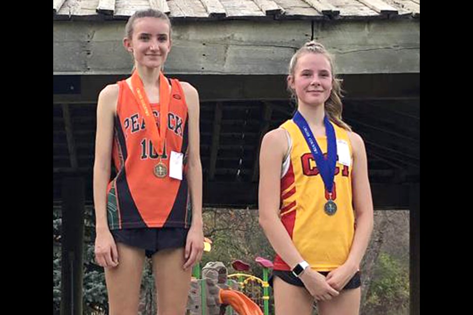 Turns out that if you’re fast in cross country, you’re fast in track, as Peacock’s Nikolina Kapovic (left) set a record in the intermediate girls 3,000 metres, just ahead of Central’s Katie Rogers, who also broke the old mark.