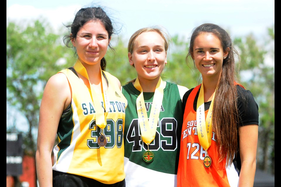 Allison Grajczyk-Jelinski of Peacock (right) won a silver medal, her second of the meet, in the 3,000 metres.