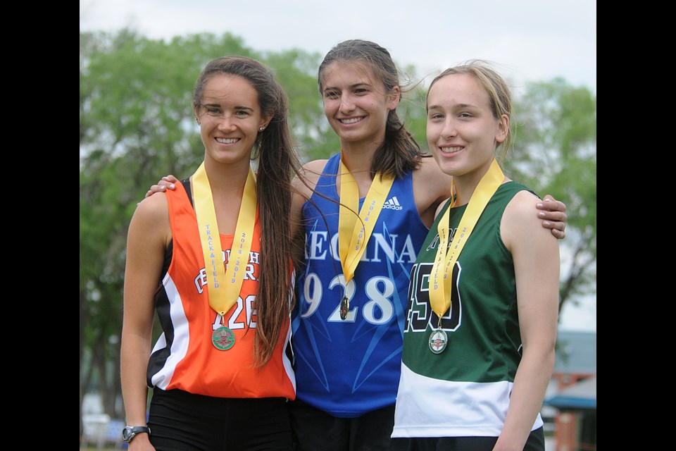 Allison Grajczyk-Jelinski (left) on the podium after winning bronze in the 1,500 metres.