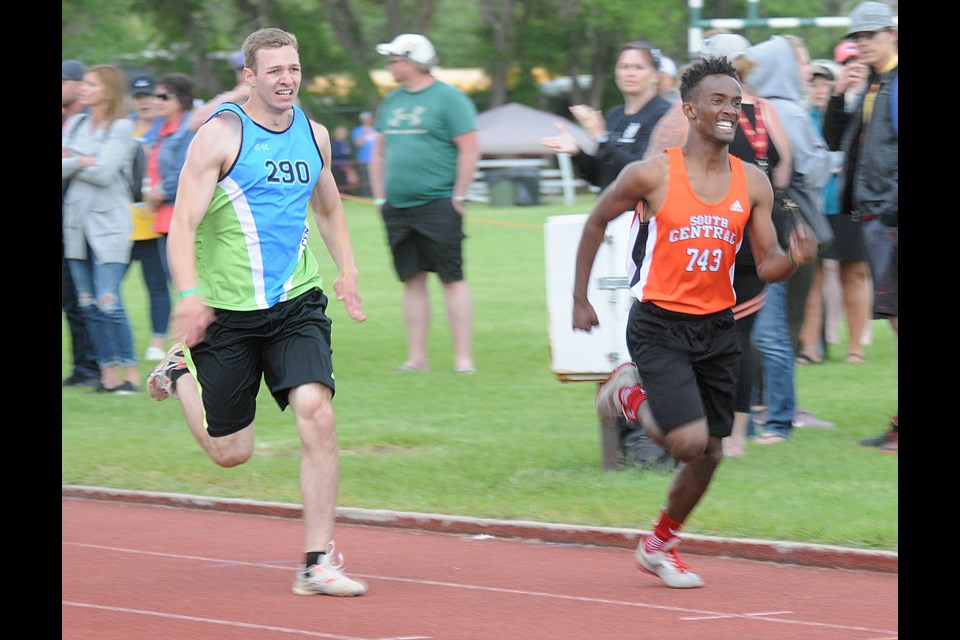 Vanier's Henok Shiferaw gave it his all in the senior boys quad 800 metres...