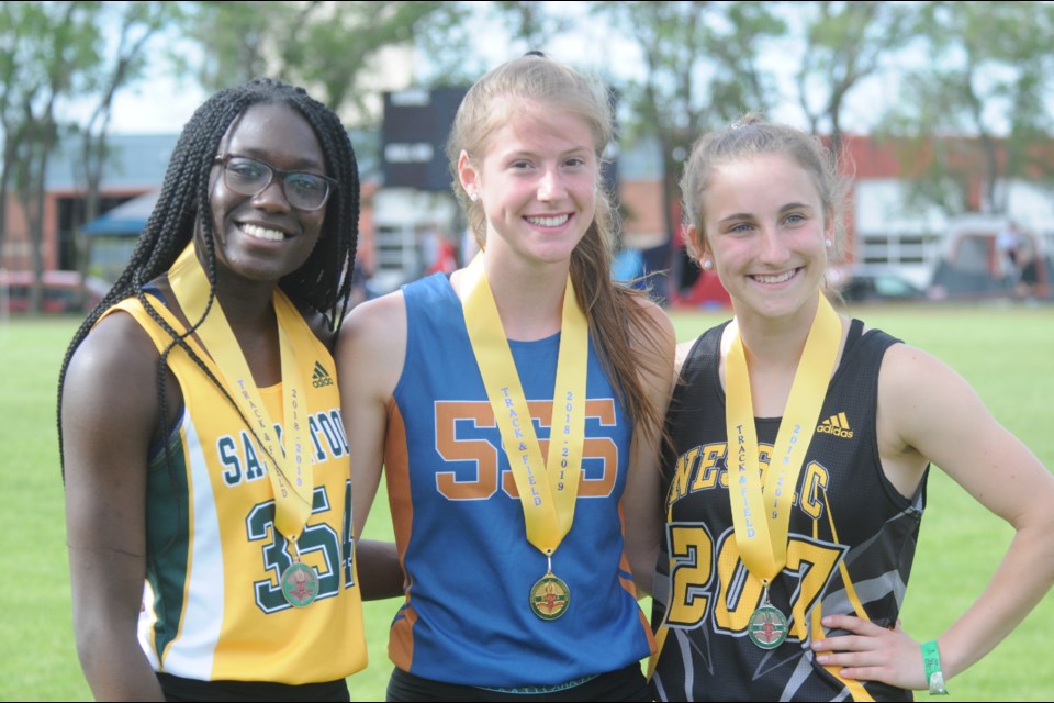 Savannah Sutherland on the podium after winning her 400 metres gold medal and setting a new record.