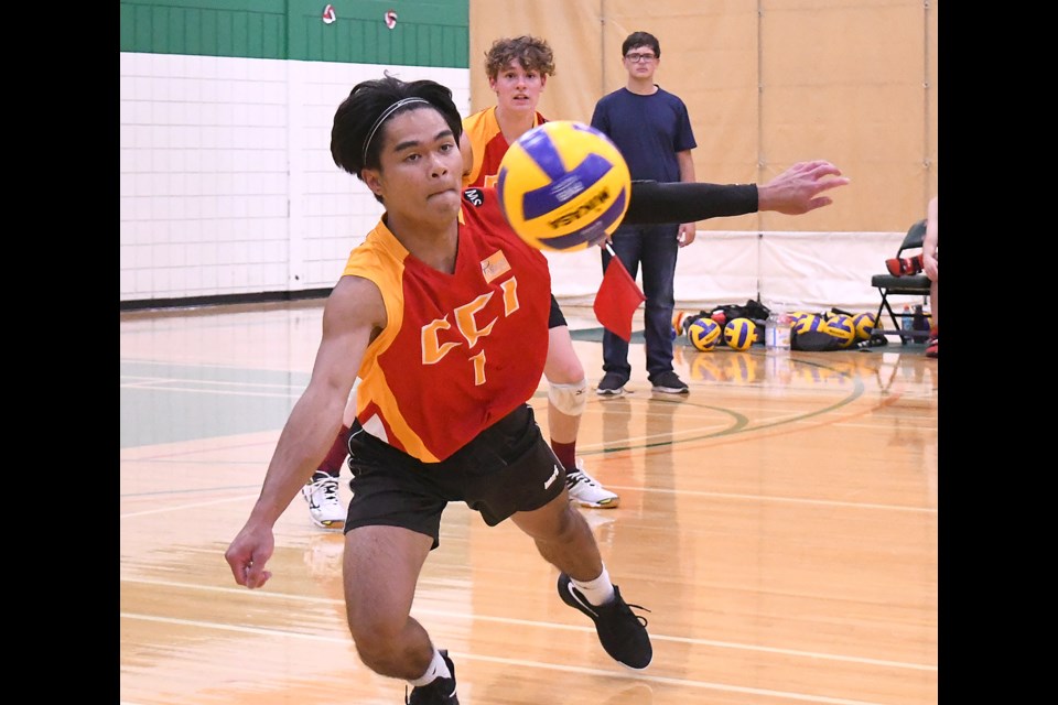 Action from the high school boys volleyball season-opening contest between the Central Cyclones and Peacock Toilers.