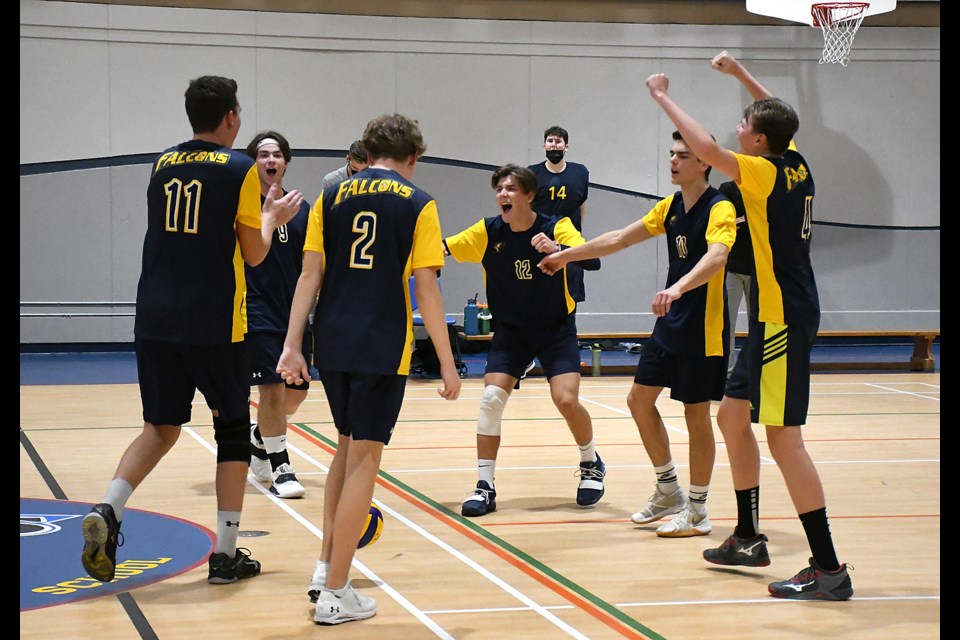 The Cornerstone Christian School Falcons celebrate after their five-set win over the Vanier Vikings