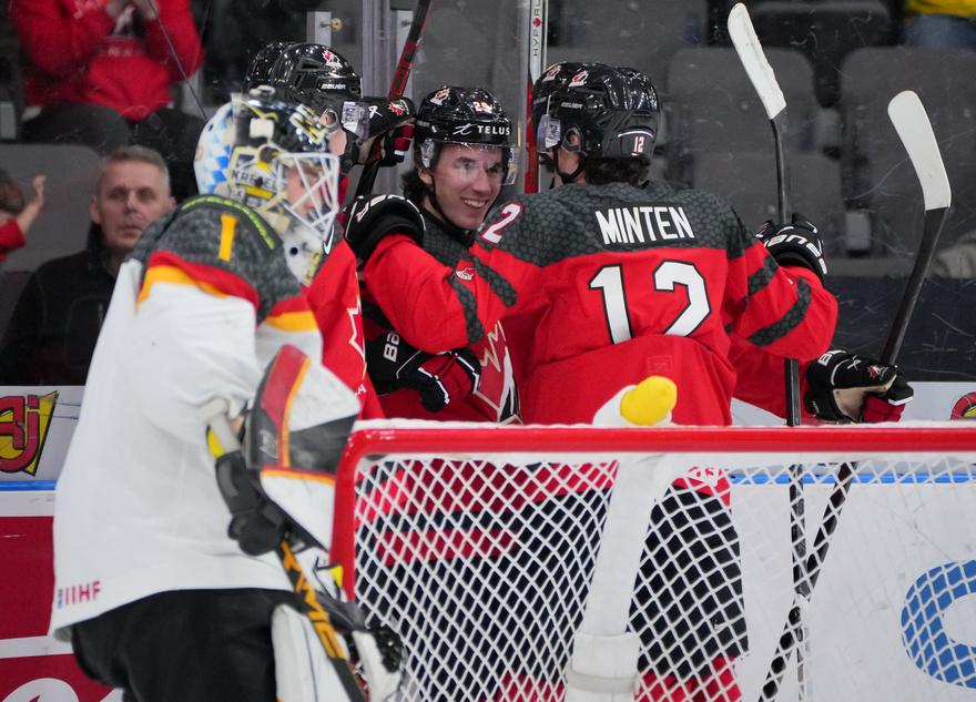 Moose Jaw Warriors forward Brayden Yager celebrates his first-period goal with Saskatoon Blades forward Fraser Minten.