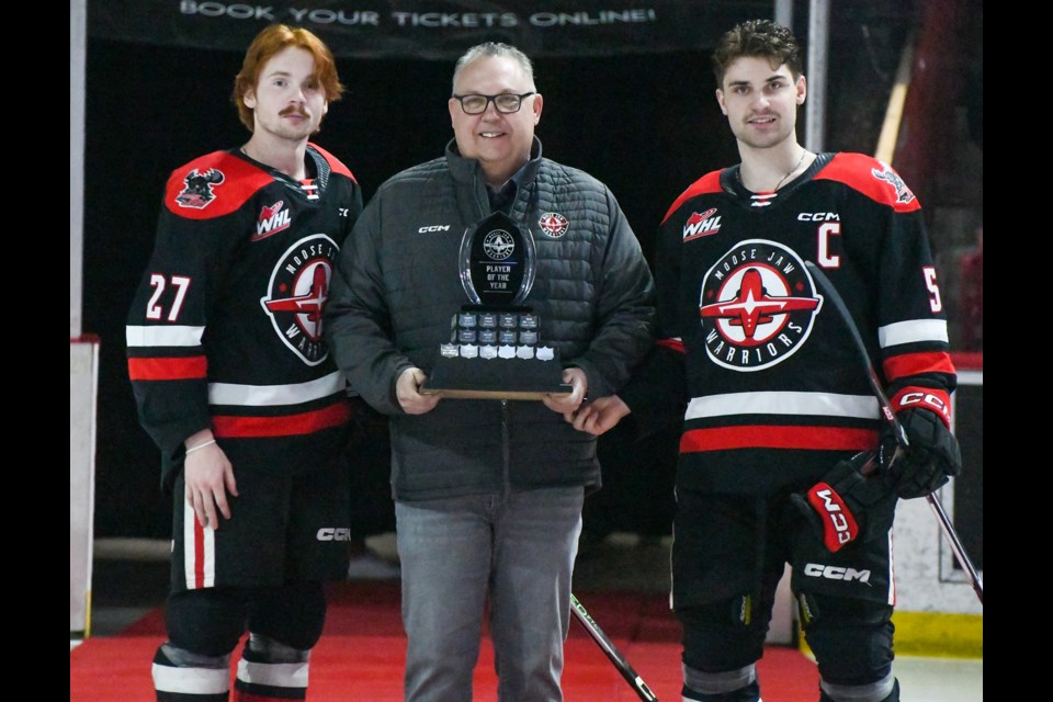 Jagger Firkus and Denton Mateychuk accept the Player of the Year Award.