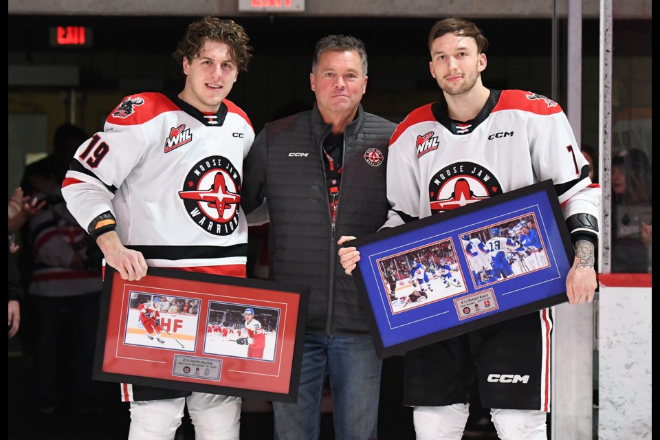 Moose Jaw Warriors forward Martin Rysavy and Robert Baco were honoured by the team for their performances with Czechia and Slovakia respectively at the World Junior Hockey Championship. Board member Scott Wray presented the players with a photo collage of them in action at the event. 