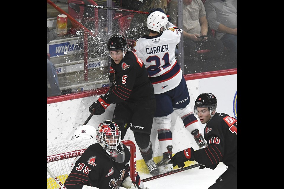 Jagger Firkus scores against the Lethbridge Hurricanes earlier this season.