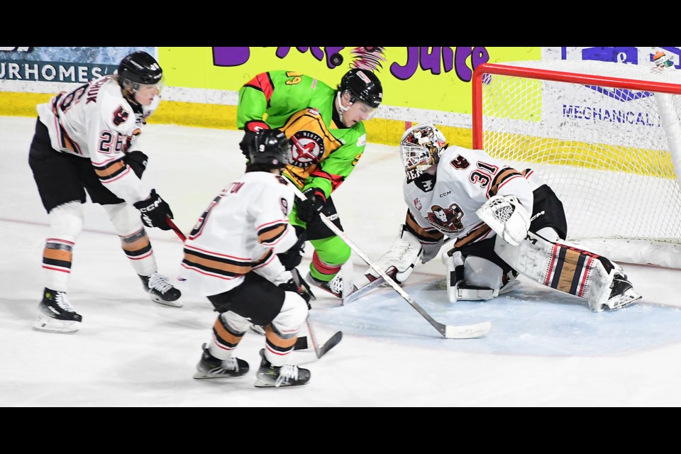 Martin Rysavy nearly scored on this play, but Alex Garrett would make the save for Calgary.