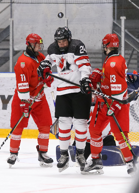 Moose Jaw Warriors Daemon Hunt (24) for Canada and Yegor Buyalski (11) for Belarus in front of the Team Canada net. Photo by Chris Tanouye/HHOF-IIHF Images.