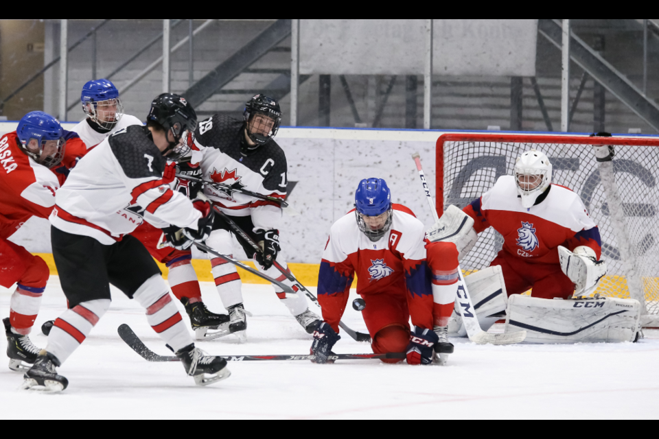 Moose Jaw Warriors forward Brayden Tracey has his shot blocked Czech Republic’s Martin Has during action from the final round robin game. Photo by Chris Tanouye/HHOF-IIHF Images