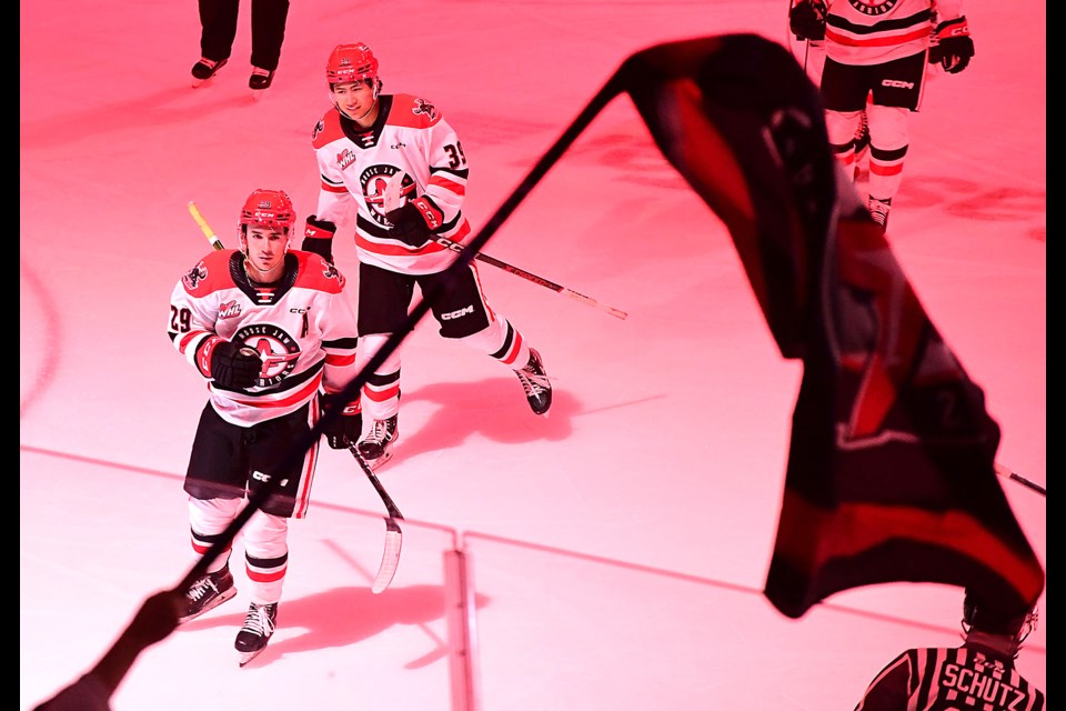 Brayden Yager and Matthew Gallant head to the bench for the flyby after one of Yager's two goals on the night.