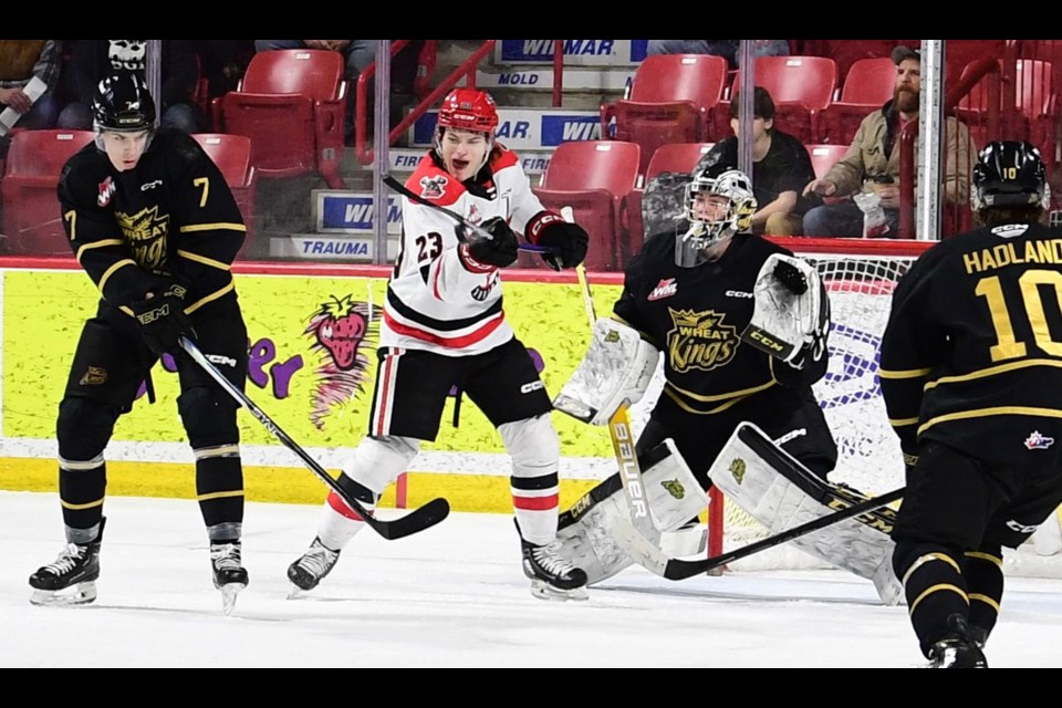 Atley Calvert gets his stick on the puck in front of Carson Bjarnason, leading to the go-ahead goal in the third period.