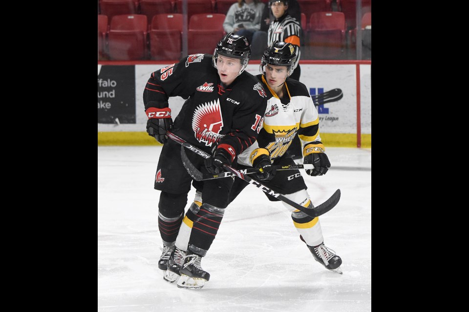 The Warriors' Calder Anderson duels with Brandon's Jonny  Lambos during pre-season action Friday.