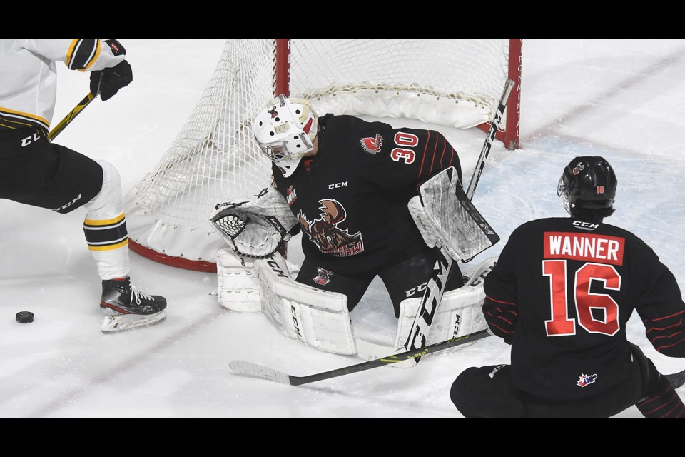 Jackson Unger directs a Brandon shot into the corner during second period action.