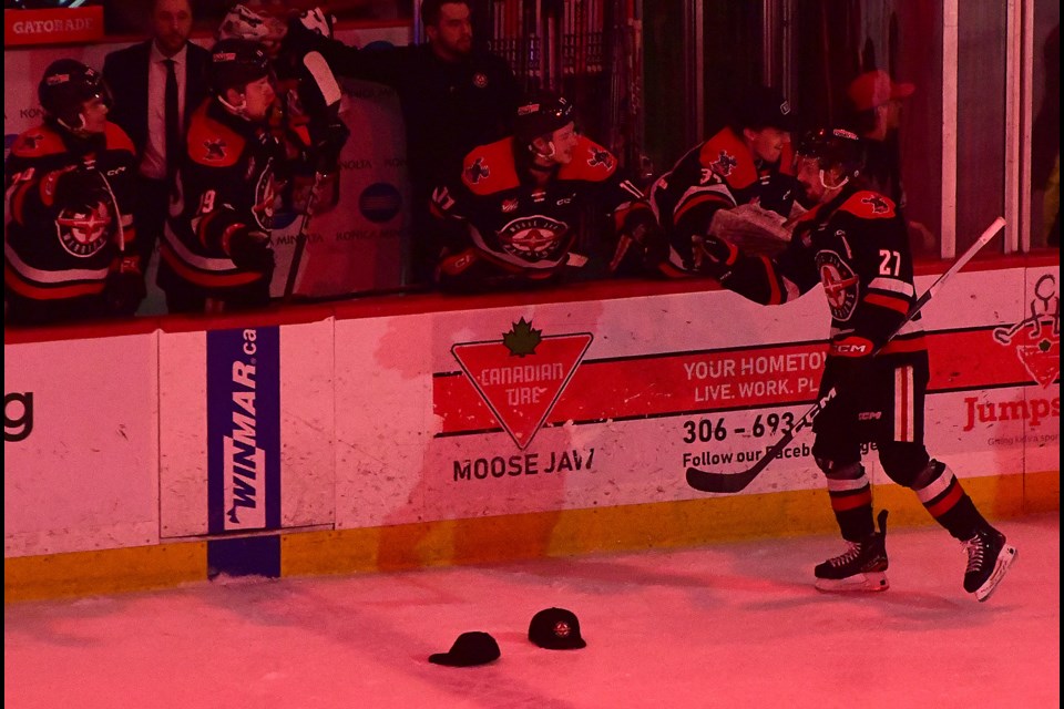 Warriors forward Jagger Firkus leads the flyby after scoring his hat trick goal in the second period.