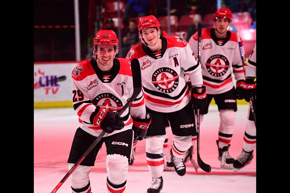 Brayden Yager and Atley Calvert were all smiles after Yager scored the Warriors' fifth goal.