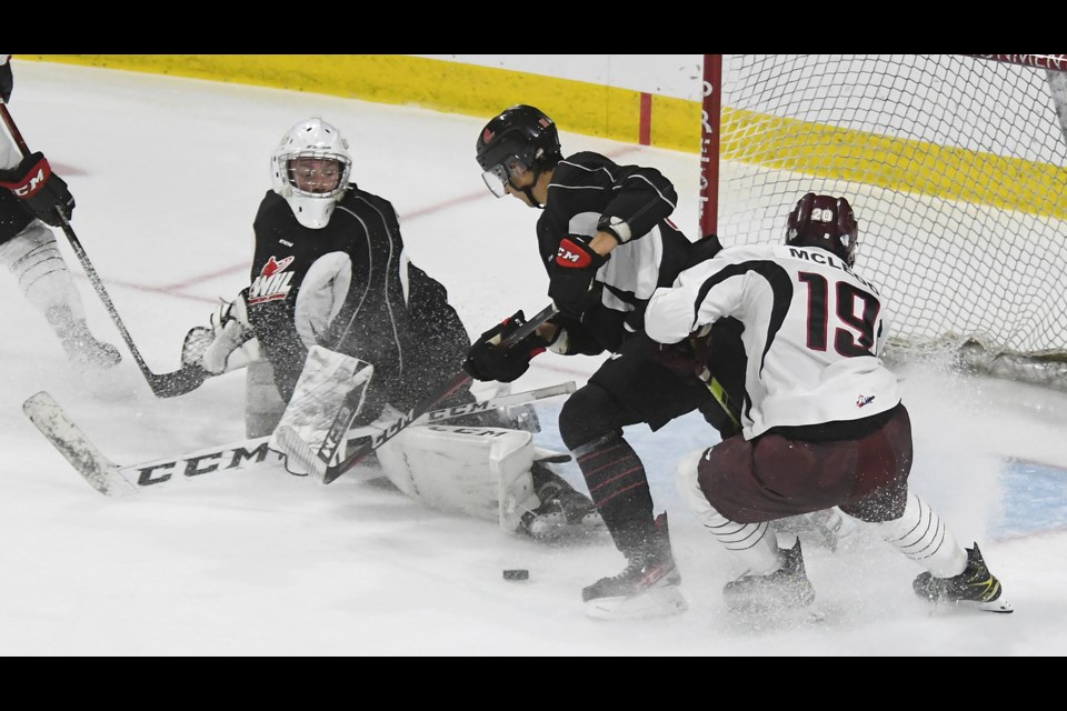 Team Black’s Jackson Unger makes the save on a Team White rush.