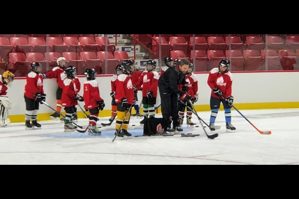 Moose Jaw Warriors assistant coach Scott King prepares to run a group of youngsters through a drill during last year’s Kids Camp
