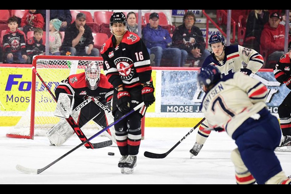 Warriors defenceman Max Wanner looks to block a shot as Connor Ungar keeps an eye on the puck.