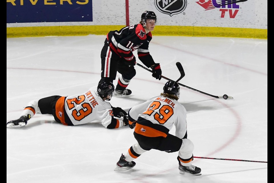 The Tigers didn’t leave the Warriros a lot of room to maneuver, as seen here as Tate Schofer looks to pass off the puck. 